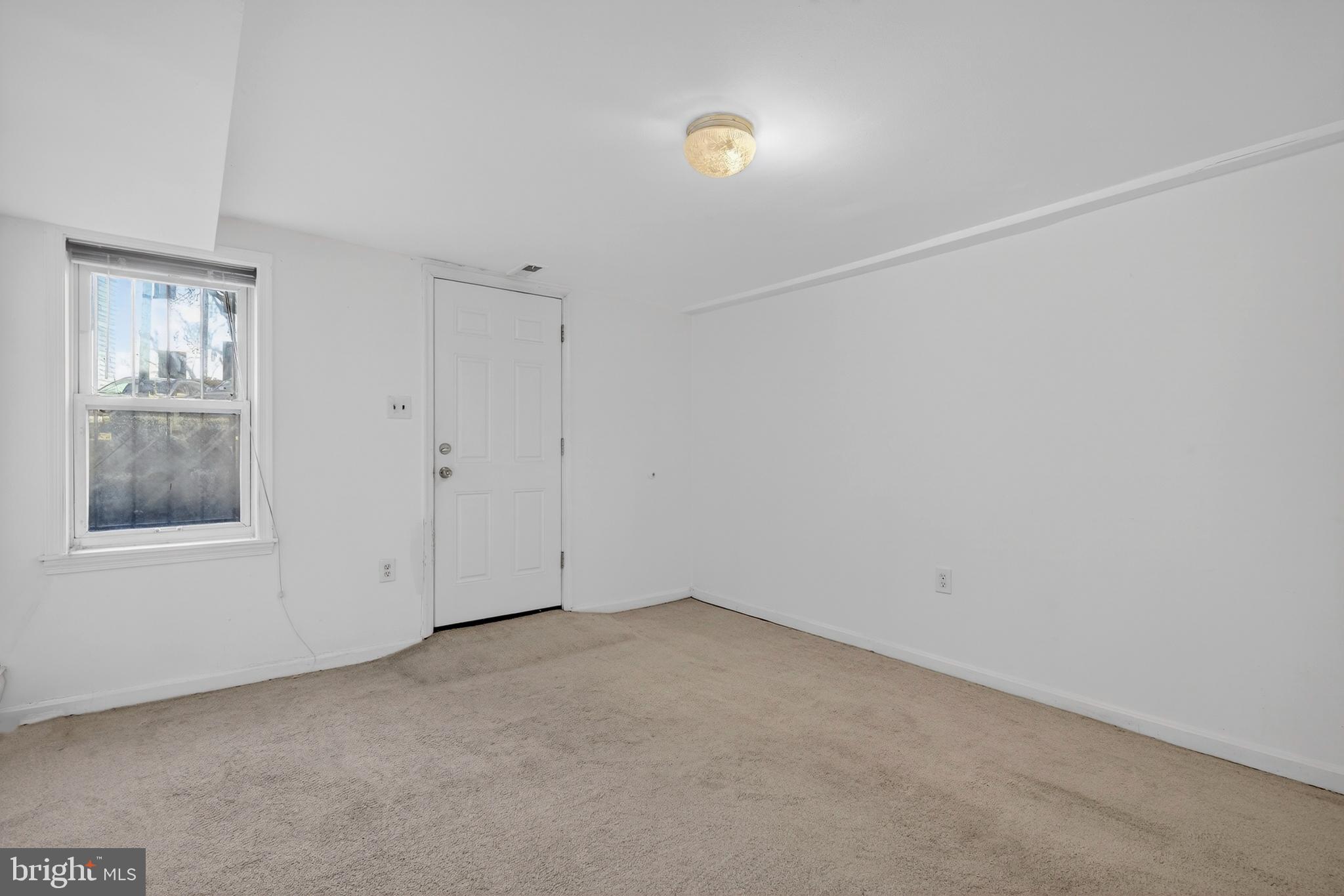 1351 Monroe Street Northwest Washington, DC 20010 - Photo 17 of 23 an empty room with a window