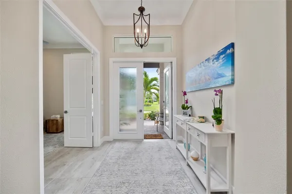 a view of hall way with furniture