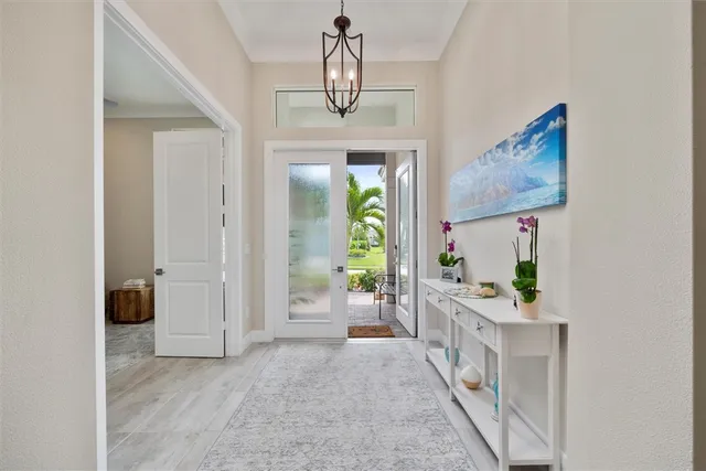 a view of hall way with furniture