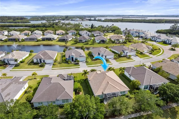 an aerial view of residential houses with outdoor space and swimming pool