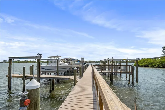a view of a roof deck with two chairs