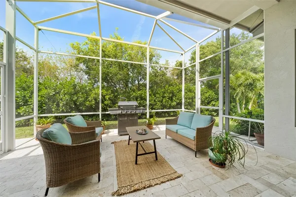 a view of a chairs and table in the patio