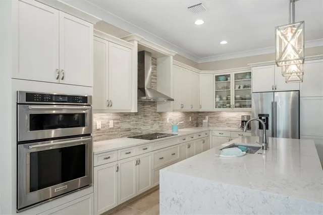 a kitchen with a sink stove and refrigerator