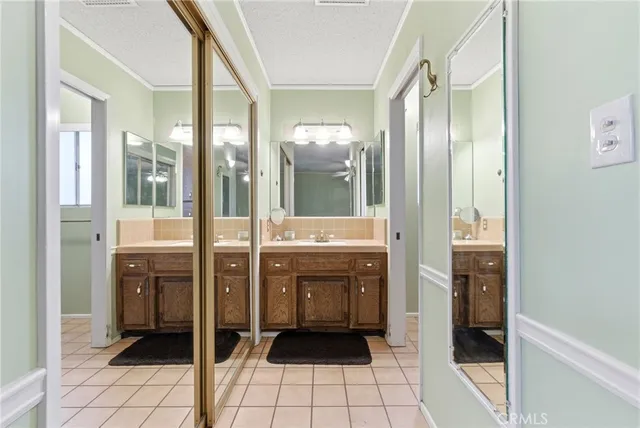 a bathroom with a double vanity sink and mirror