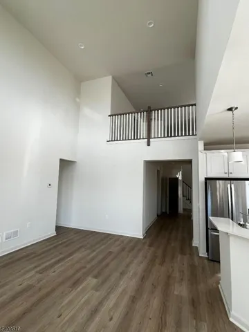 a view of kitchen and wooden floor