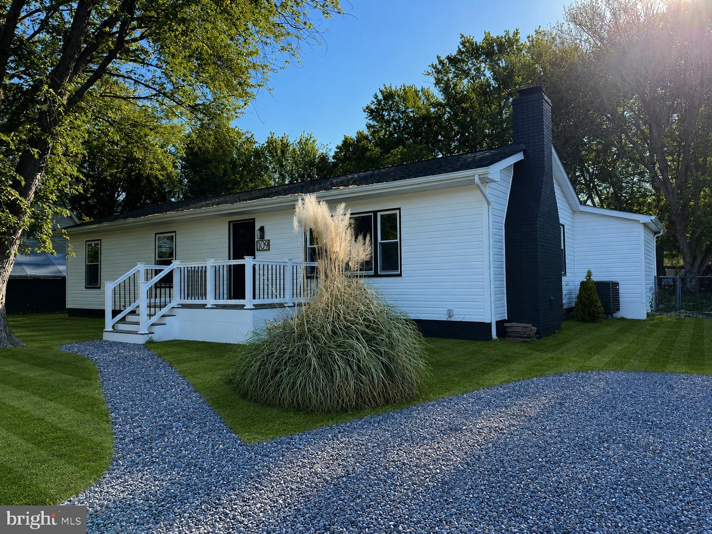 Charming home with lush greenery.
