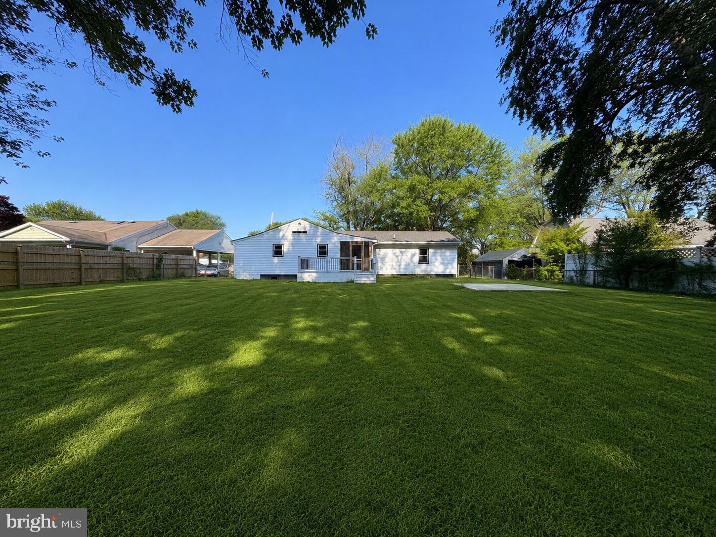 109 Birch Road Stevensville, MD 21666 - Photo 56 of 61 Spacious backyard with lush greenery.