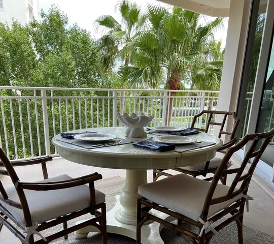 a view of a chairs and table on the deck