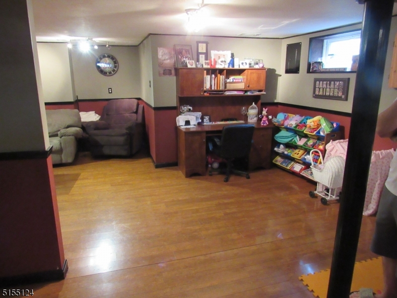 1033 Grove Street North Brunswick, NJ 08902 - Photo 13 of 14 a room with furniture and a flat screen tv