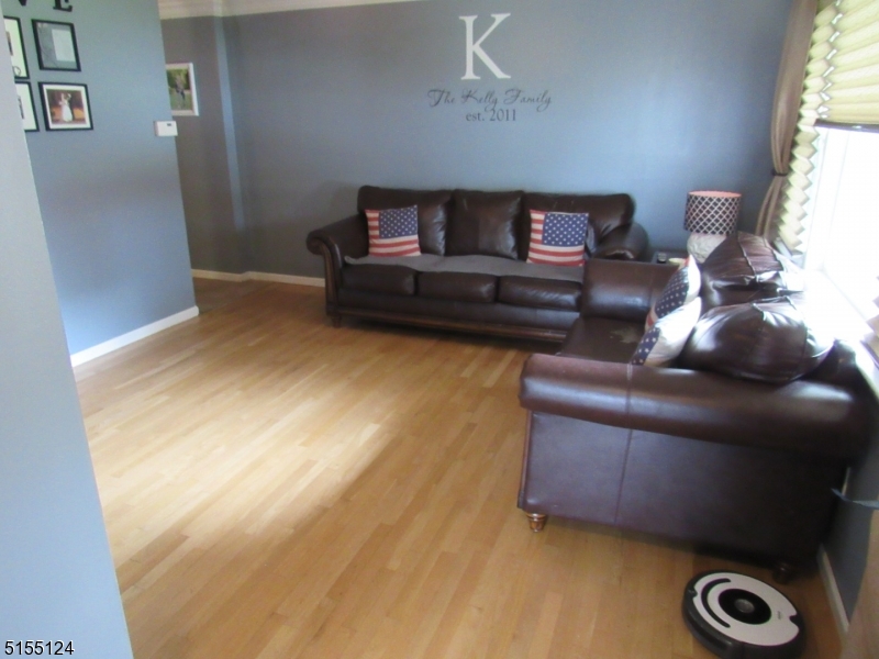 1033 Grove Street North Brunswick, NJ 08902 - Photo 2 of 14 a living room with furniture and a window