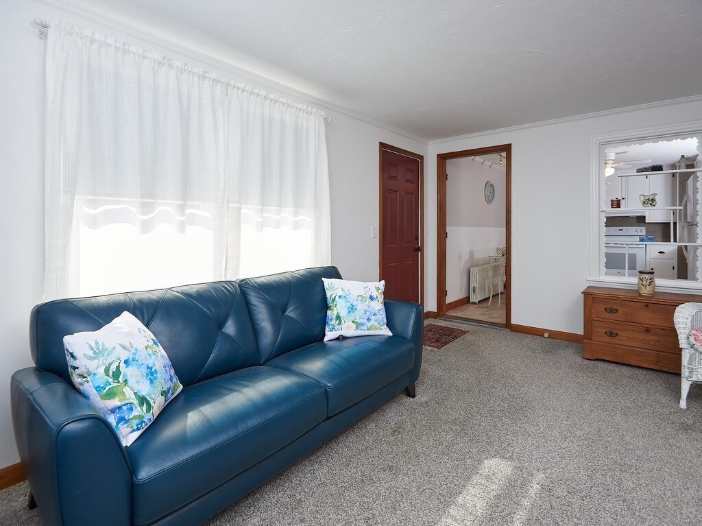 7 Oxbow Road Oxford, MA 01537 - Photo 4 of 33 a living room with furniture and a window