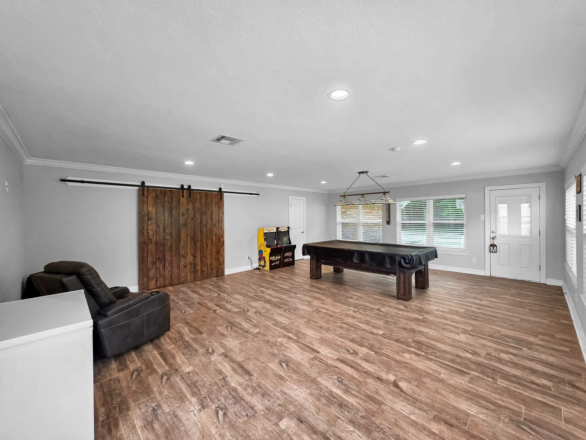 2641 Oilla Road Orange, TX 77630 - Photo 34 of 50 a large room with wooden floor and furniture