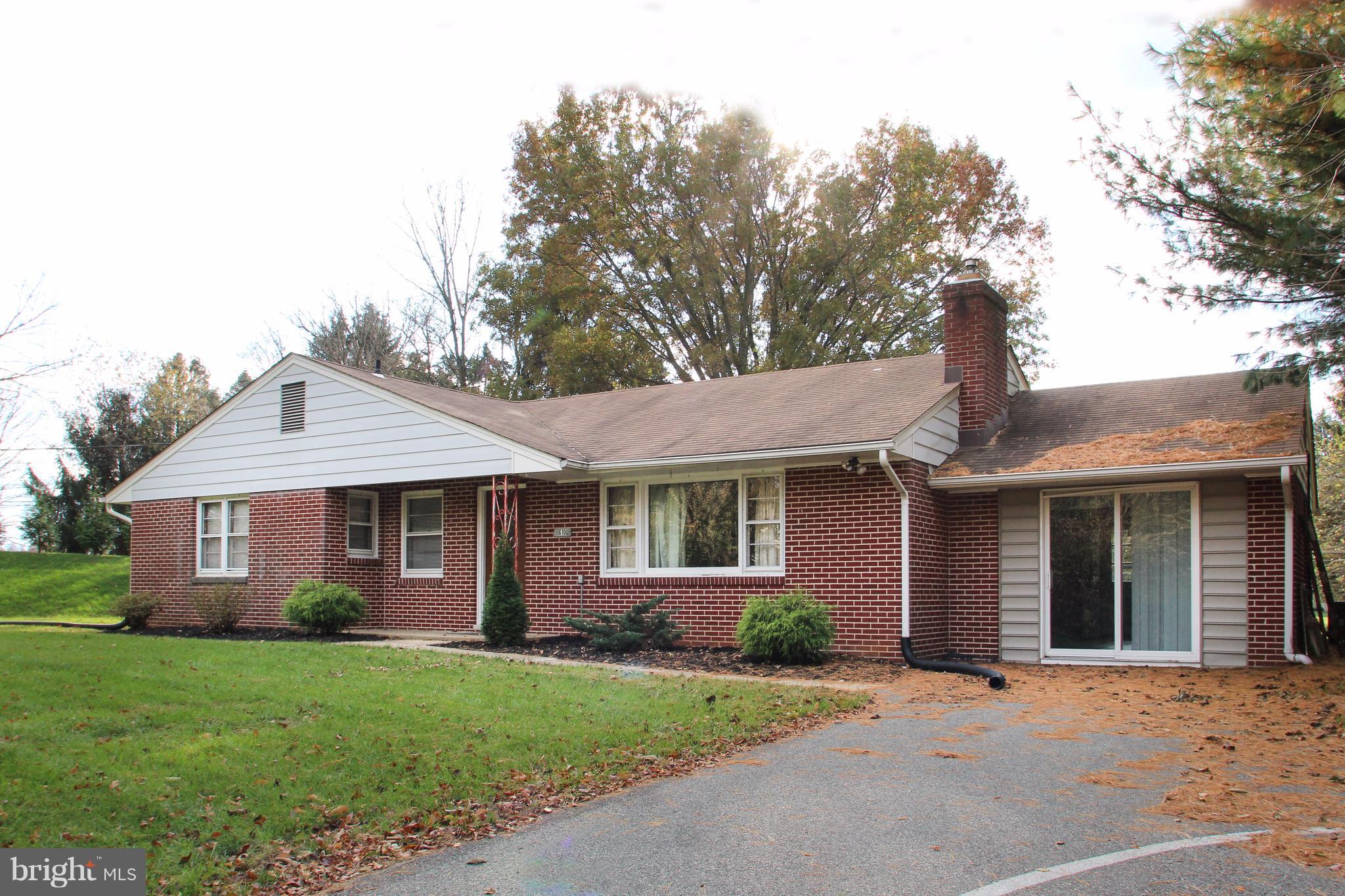610 Mountain Road Fallston, MD 21047 - Photo 1 of 29 a front view of a house with a garden and trees
