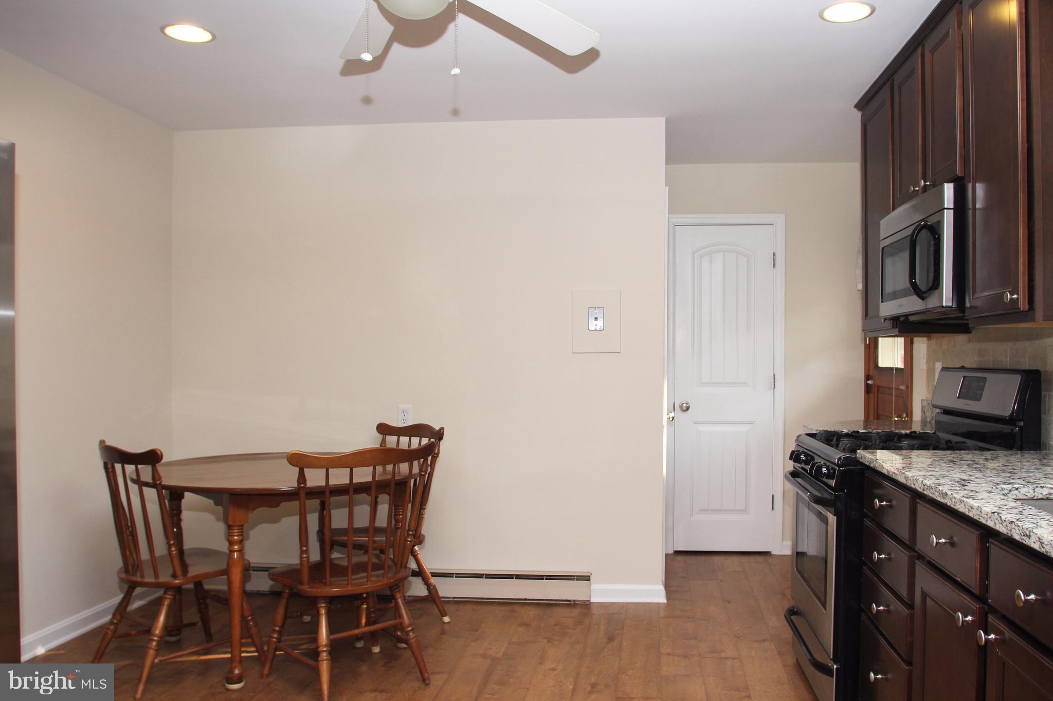 610 Mountain Road Fallston, MD 21047 - Photo 13 of 29 a dining room with furniture and wooden floor