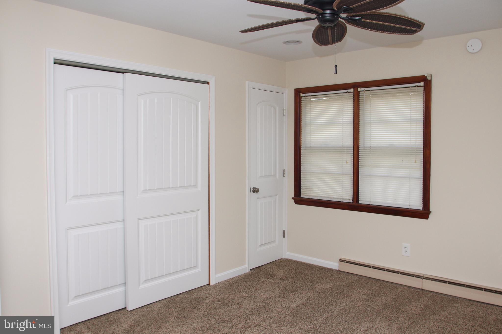 610 Mountain Road Fallston, MD 21047 - Photo 18 of 29 an empty room with a window and a fan