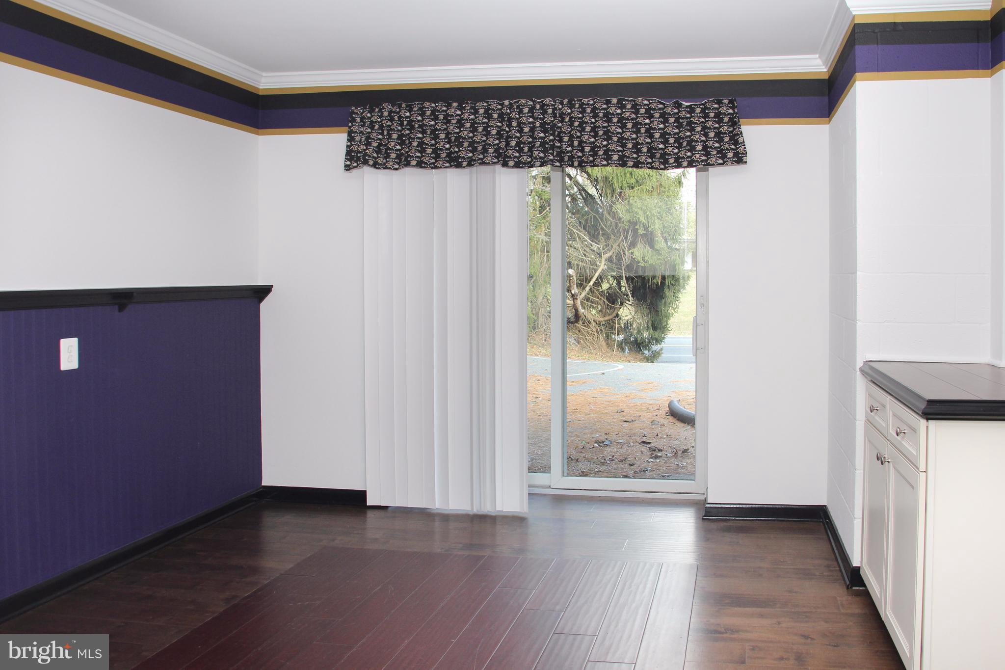610 Mountain Road Fallston, MD 21047 - Photo 27 of 29 an empty room with wooden floor and windows