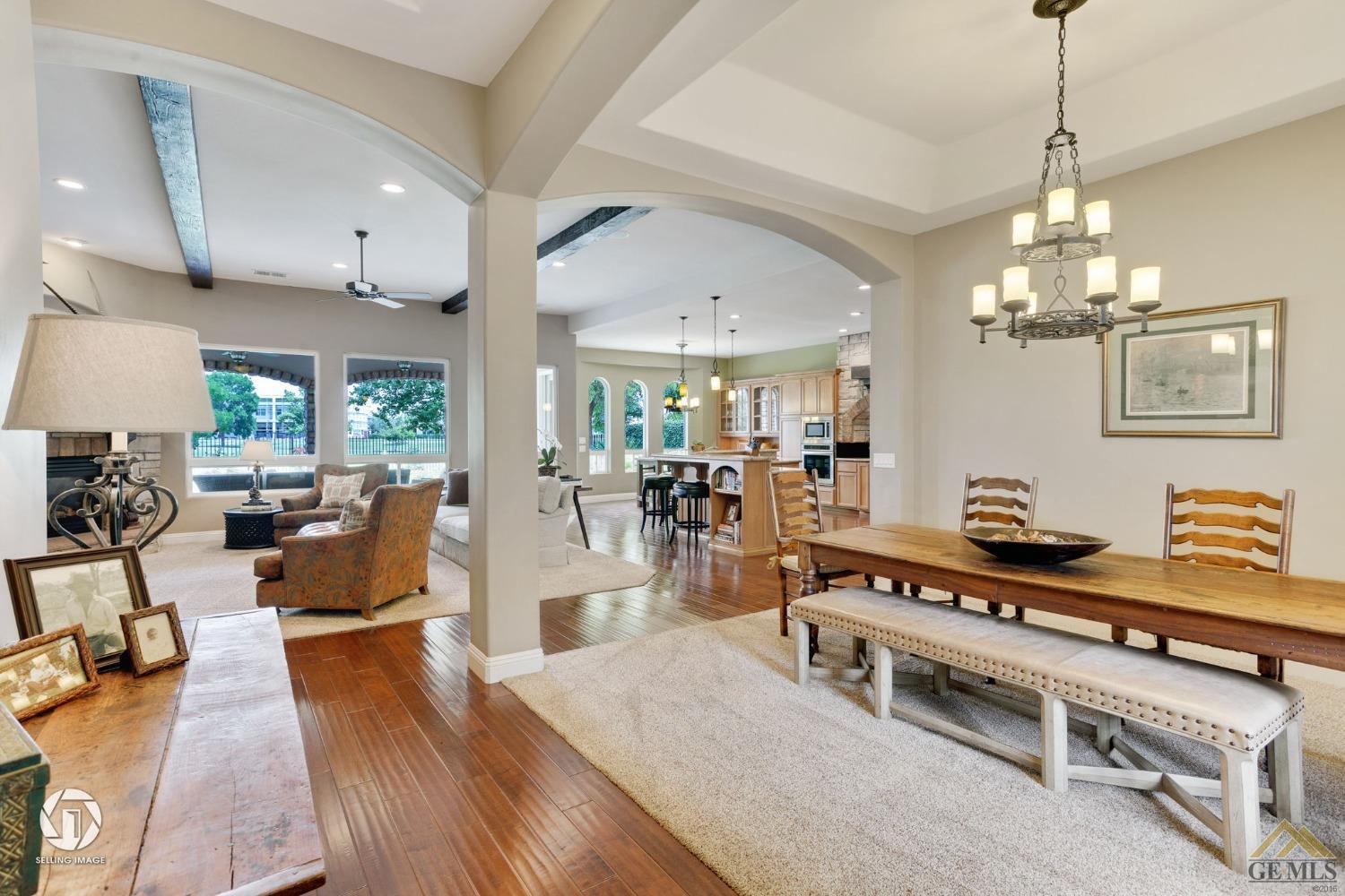 Undisclosed Address Bakersfield, CA 93311 - Photo 11 of 58 a living room with furniture and a chandelier