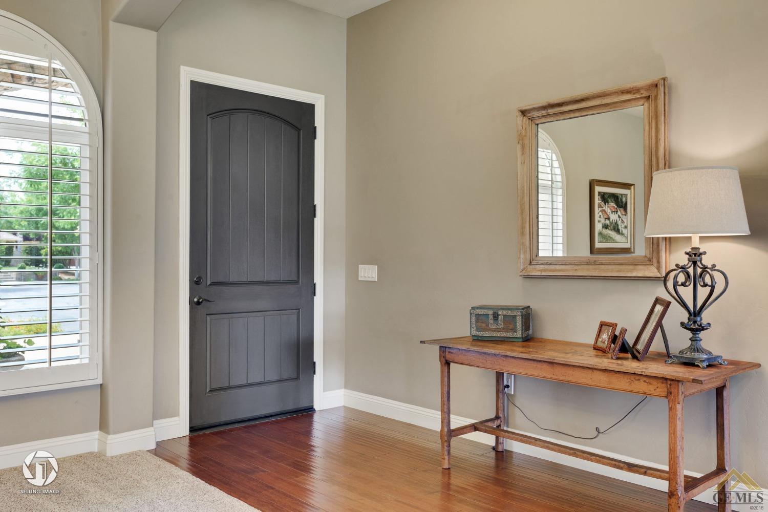 Undisclosed Address Bakersfield, CA 93311 - Photo 12 of 58 a view of a workspace room with wooden floor cabinet and cabinet