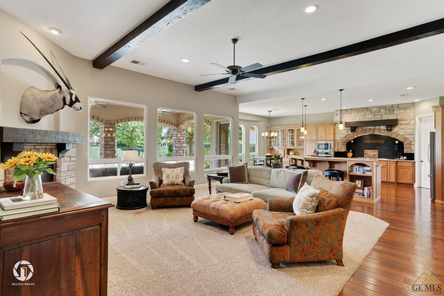 Undisclosed Address Bakersfield, CA 93311 - Photo 13 of 58 a living room with furniture kitchen view and a large window