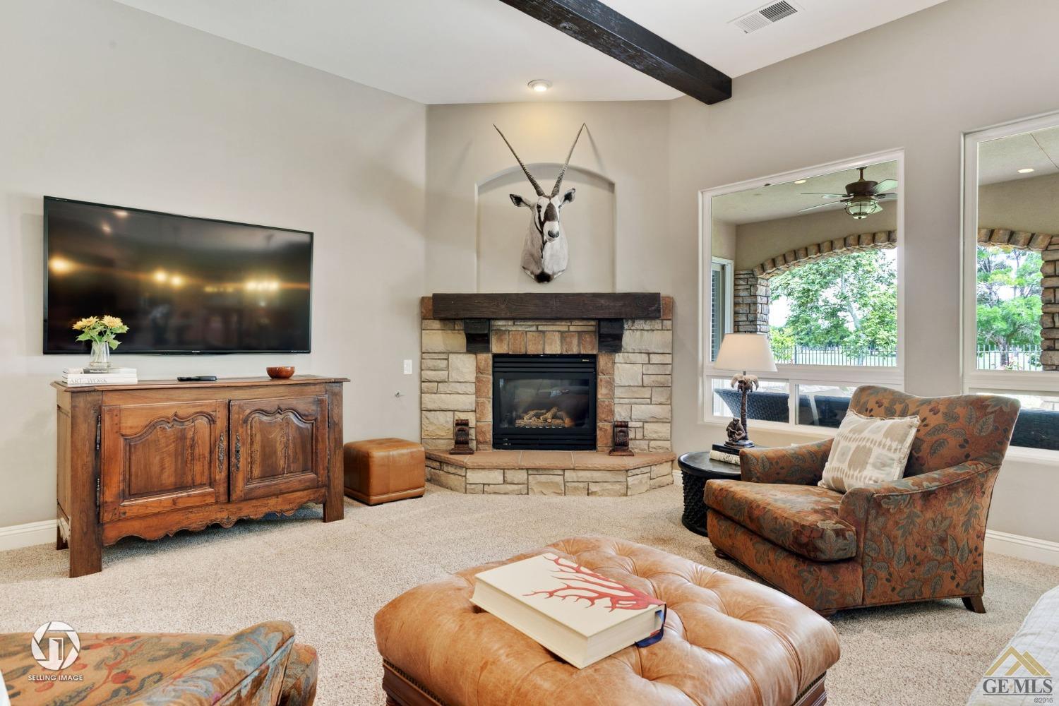 Undisclosed Address Bakersfield, CA 93311 - Photo 15 of 58 a living room with furniture and a flat screen tv