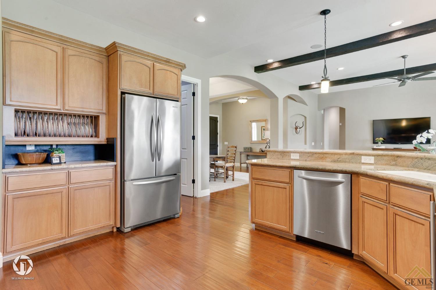 Undisclosed Address Bakersfield, CA 93311 - Photo 23 of 58 a kitchen with stainless steel appliances a refrigerator sink and cabinets