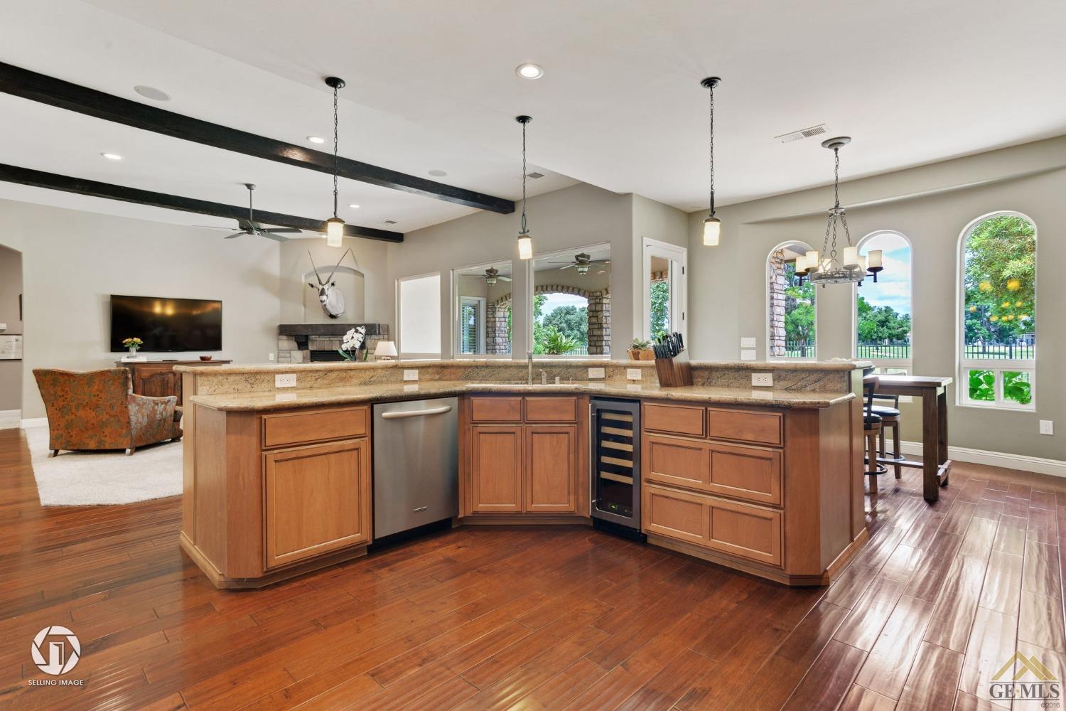 Undisclosed Address Bakersfield, CA 93311 - Photo 26 of 58 a kitchen with a sink appliances and wooden floor