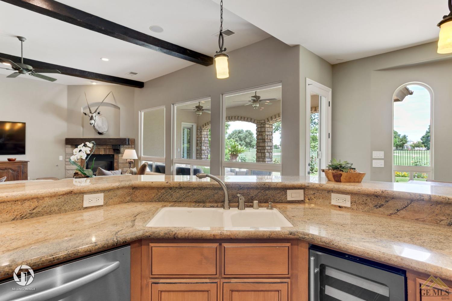 Undisclosed Address Bakersfield, CA 93311 - Photo 27 of 58 a kitchen with granite countertop sink and window