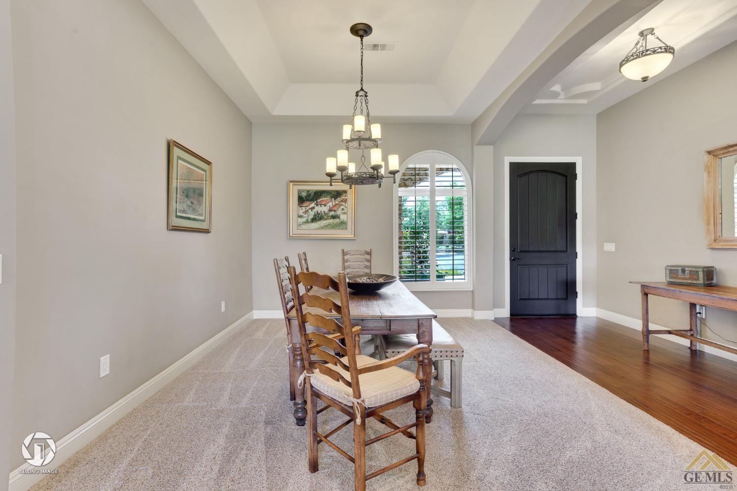 Undisclosed Address Bakersfield, CA 93311 - Photo 28 of 58 a living room with furniture and a chandelier