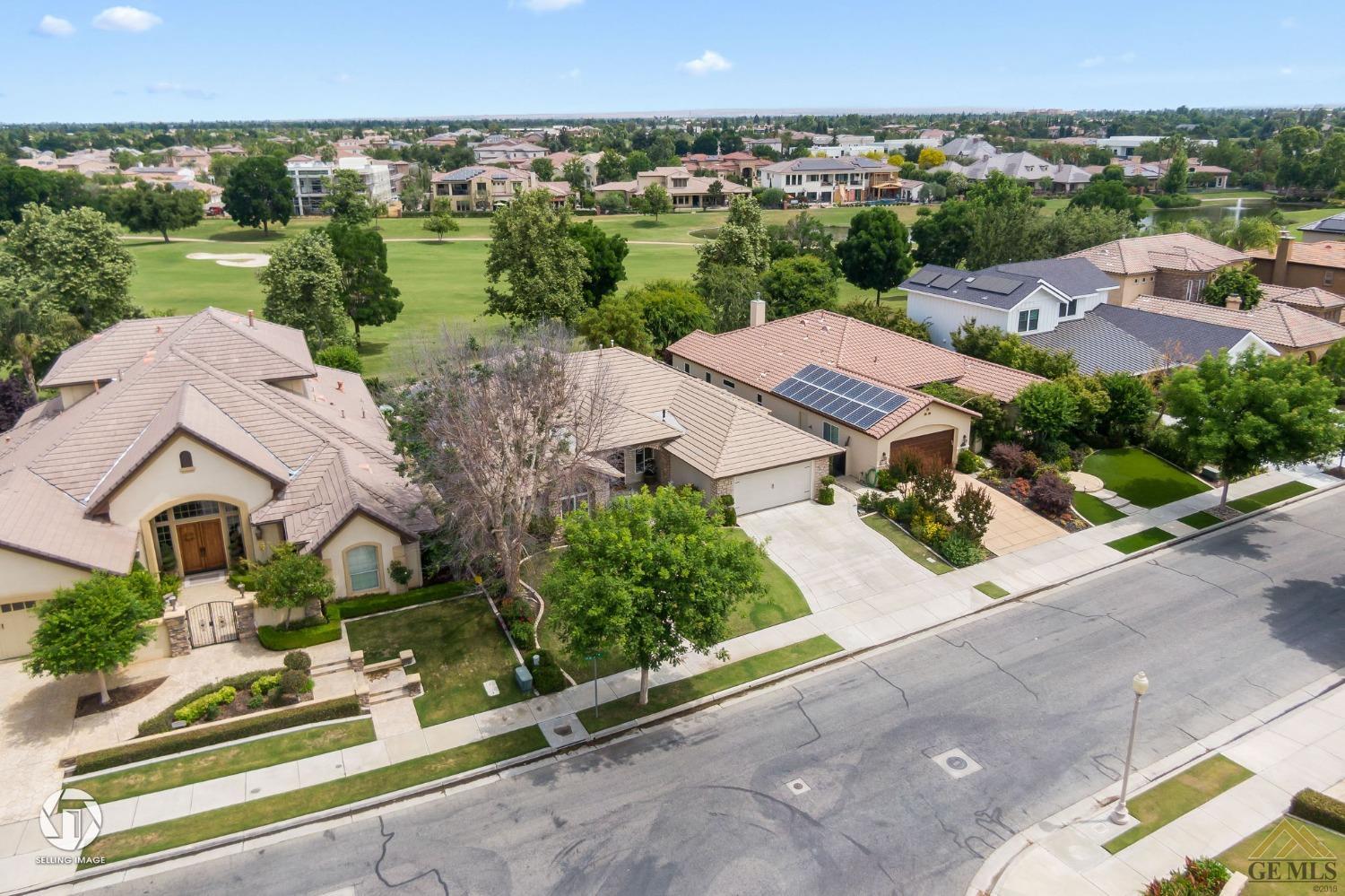 Undisclosed Address Bakersfield, CA 93311 - Photo 3 of 58 an aerial view of multiple houses with a yard