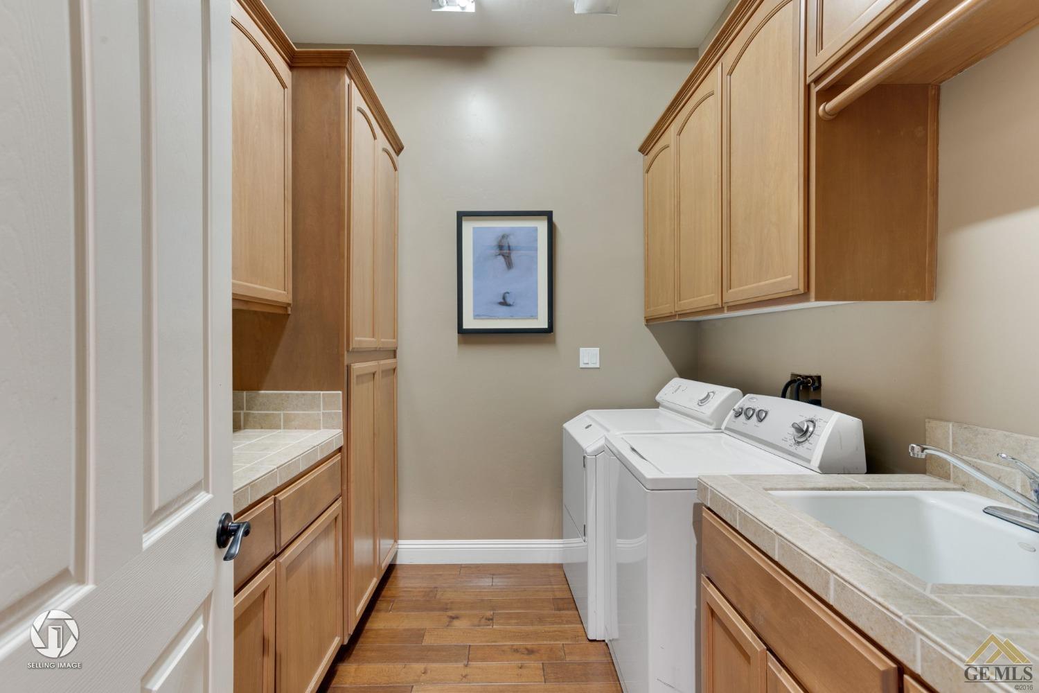 Undisclosed Address Bakersfield, CA 93311 - Photo 31 of 58 a utility room with dryer and washer