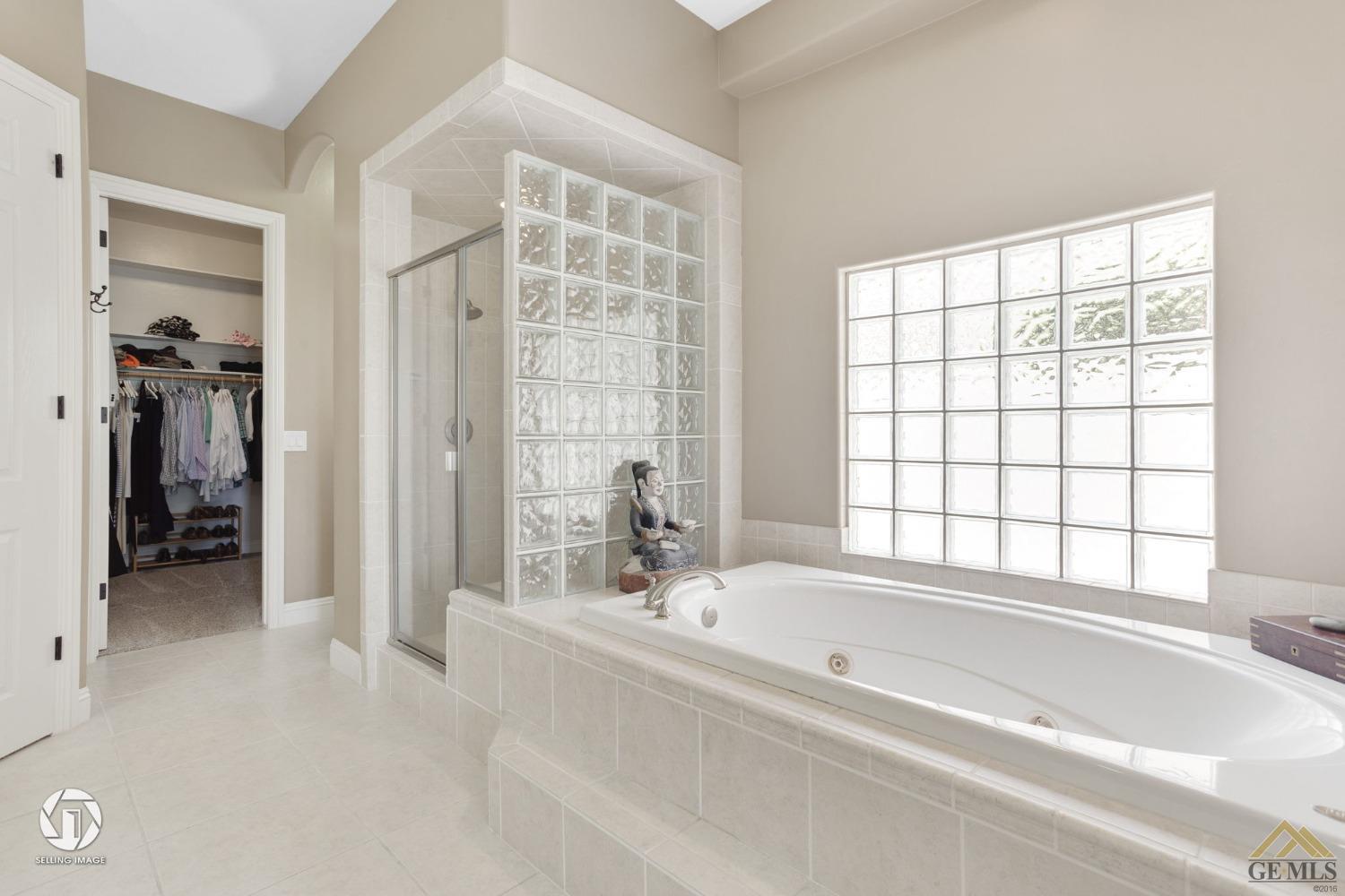 Undisclosed Address Bakersfield, CA 93311 - Photo 38 of 58 a spacious bathroom with bathtub and shower