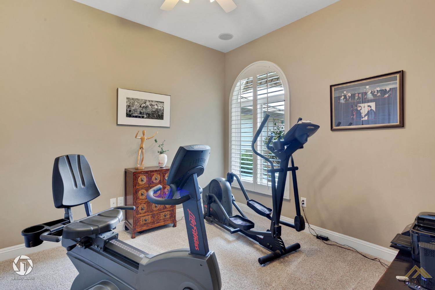 Undisclosed Address Bakersfield, CA 93311 - Photo 41 of 58 a view of a workspace with furniture and a window