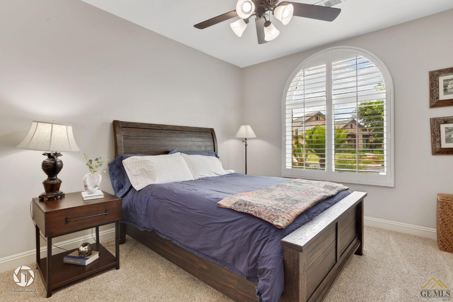 Undisclosed Address Bakersfield, CA 93311 - Photo 44 of 58 a bedroom with a bed and a table