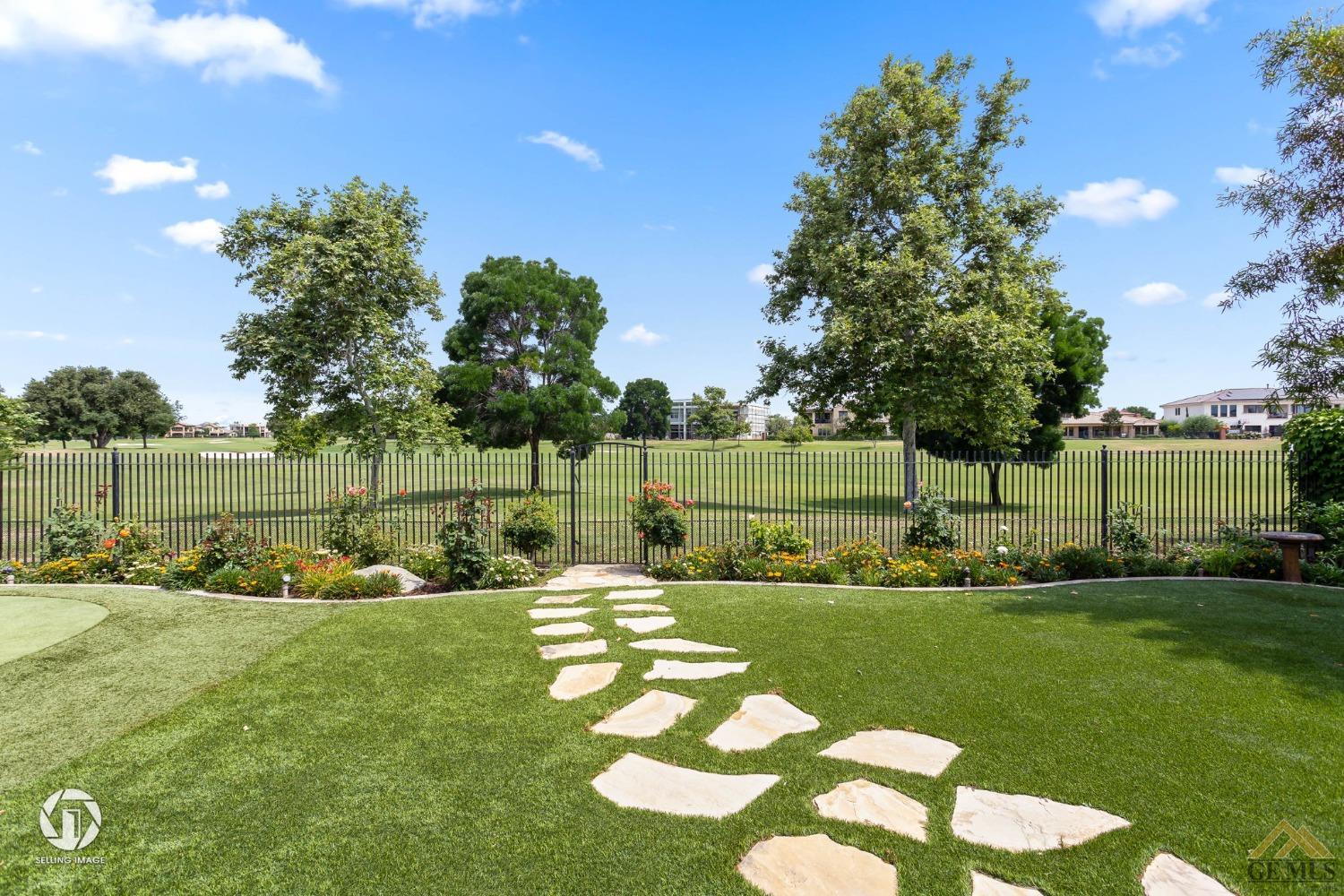 Undisclosed Address Bakersfield, CA 93311 - Photo 48 of 58 a view of a golf course with a bench