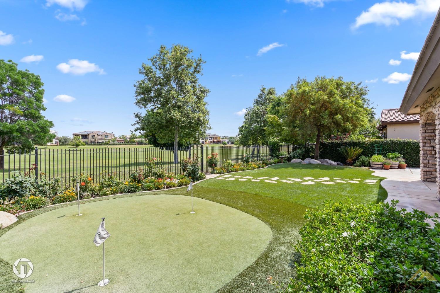 Undisclosed Address Bakersfield, CA 93311 - Photo 49 of 58 a view of a swimming pool and trees in the background