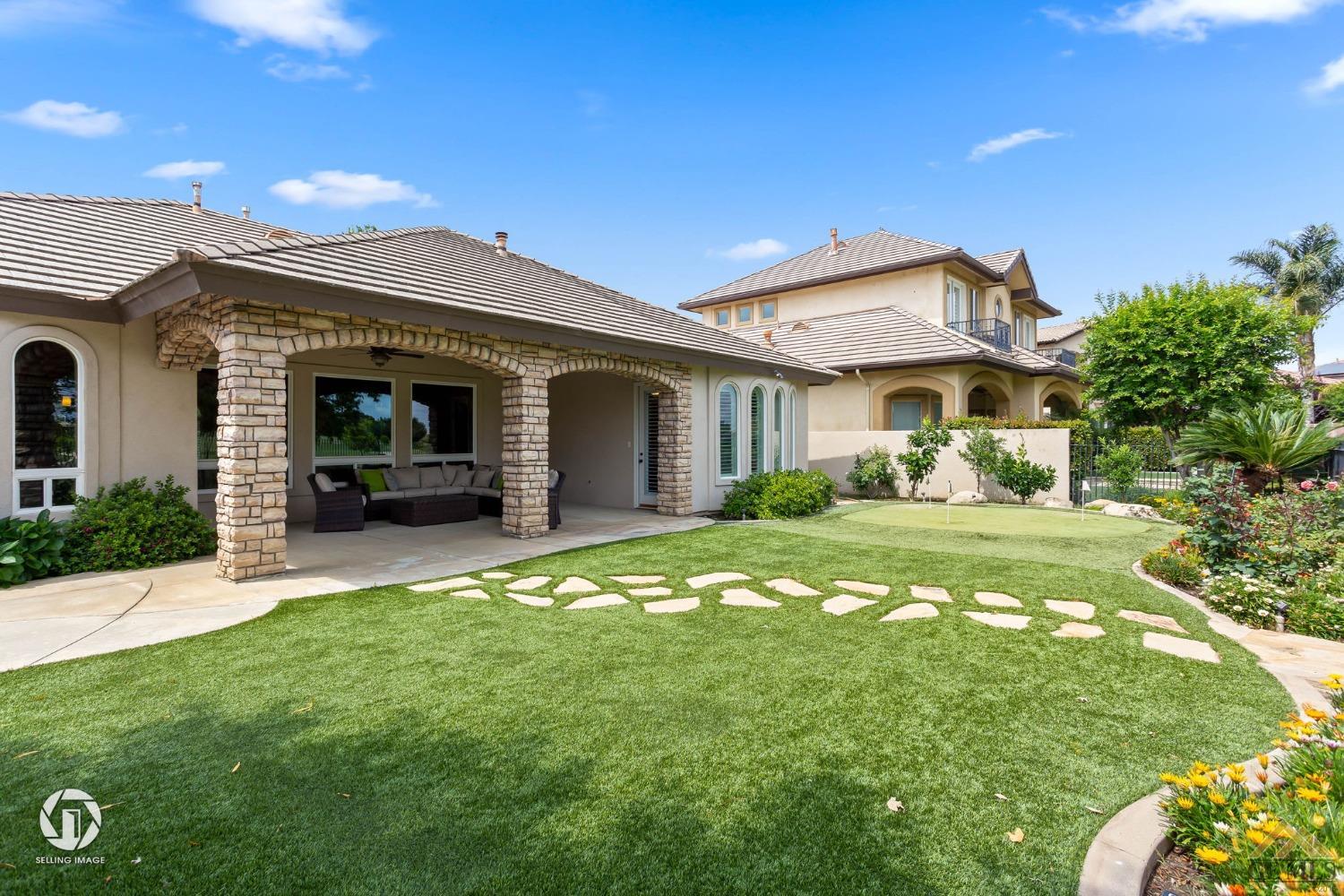 Undisclosed Address Bakersfield, CA 93311 - Photo 51 of 58 a front view of a house with a garden