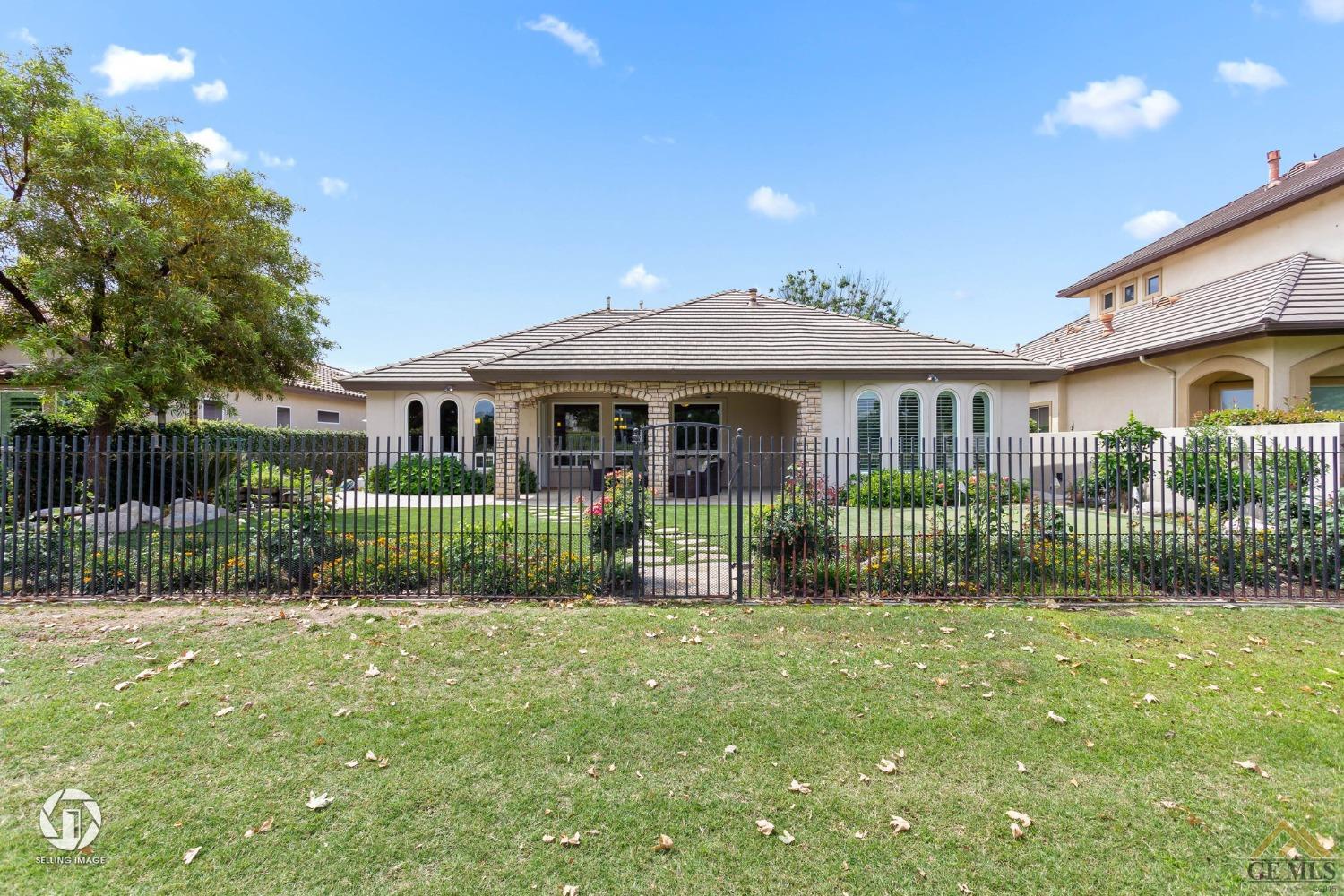 Undisclosed Address Bakersfield, CA 93311 - Photo 52 of 58 a front view of a house with a yard