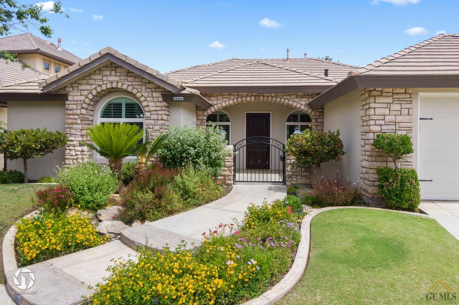 Undisclosed Address Bakersfield, CA 93311 - Photo 8 of 58 a front view of a house with garden