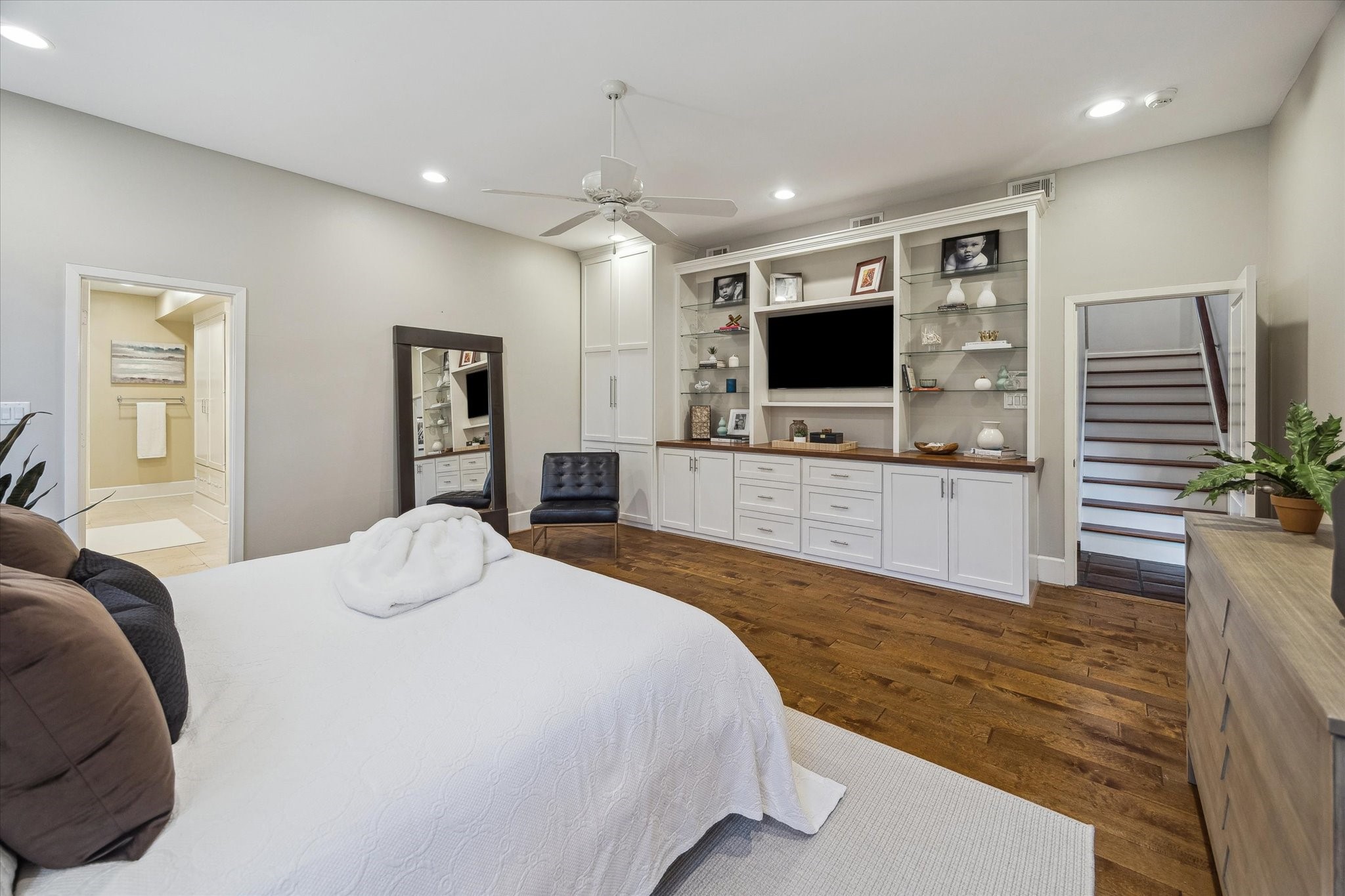 10818 Pepper Lane Houston, TX 77079 - Photo 16 of 34 Another view of the primary bedroom, with custom built-ins for additional storage