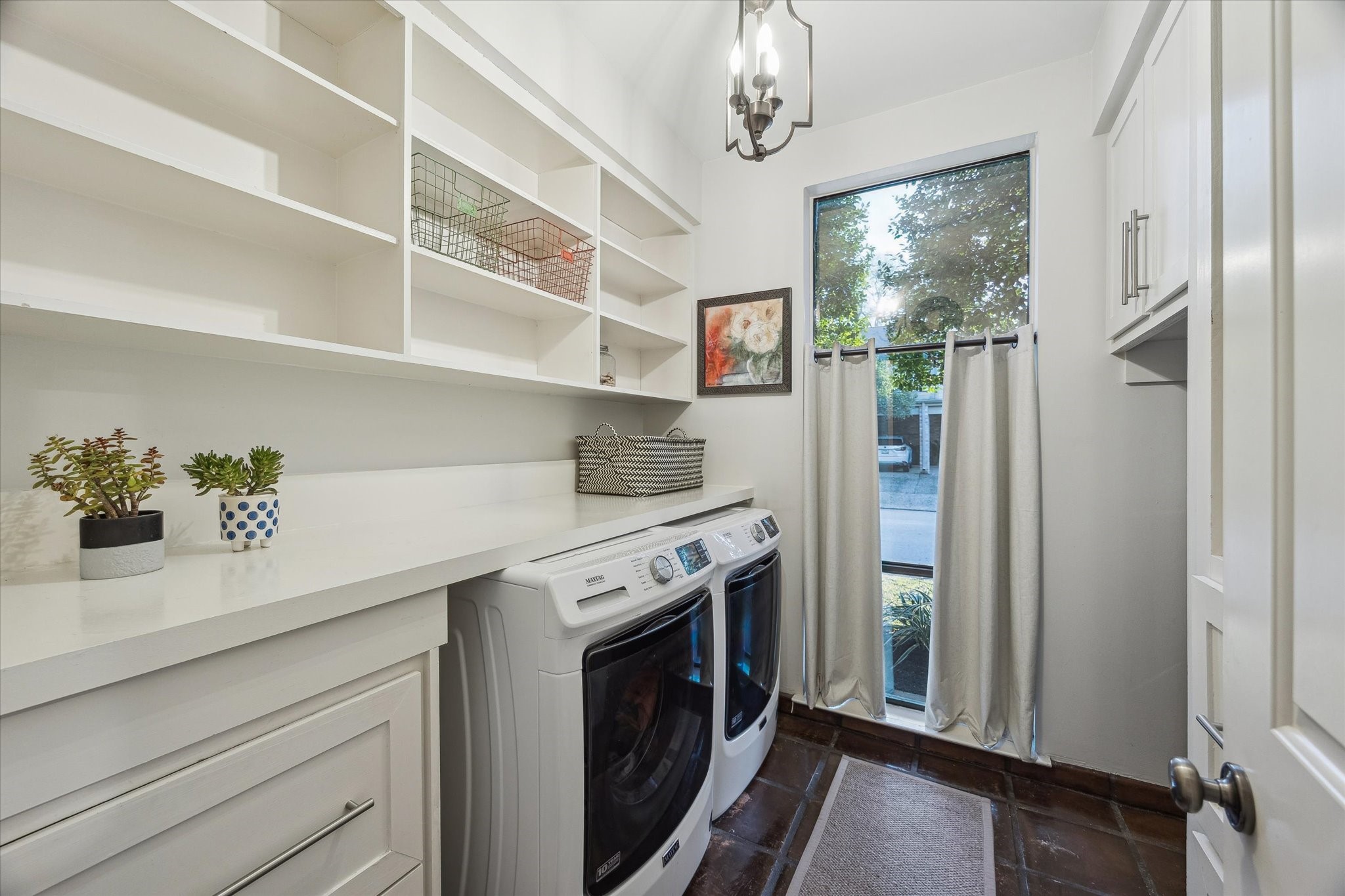10818 Pepper Lane Houston, TX 77079 - Photo 21 of 34 The downstairs laundry room offers extra cabinet space for added storage