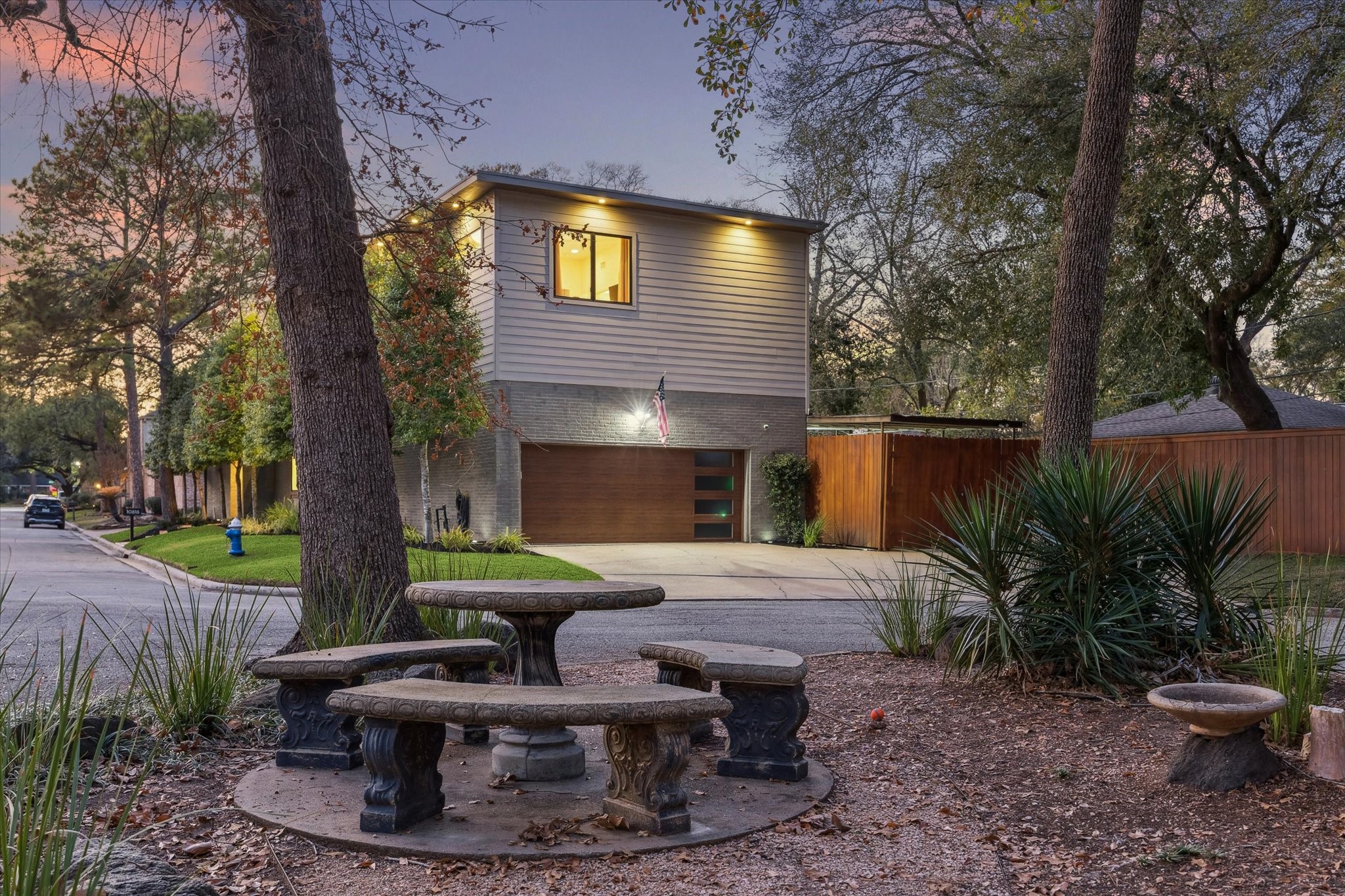 10818 Pepper Lane Houston, TX 77079 - Photo 34 of 34 The property has a two-car garage with an additional carport to the right, providing extra parking