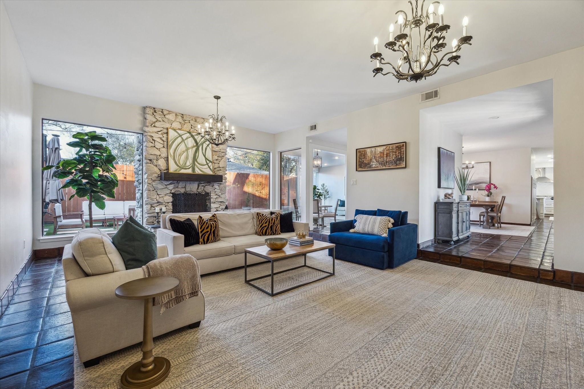 10818 Pepper Lane Houston, TX 77079 - Photo 5 of 34 The living room features 10-foot ceilings and a beautiful stone fireplace with a wood mantel