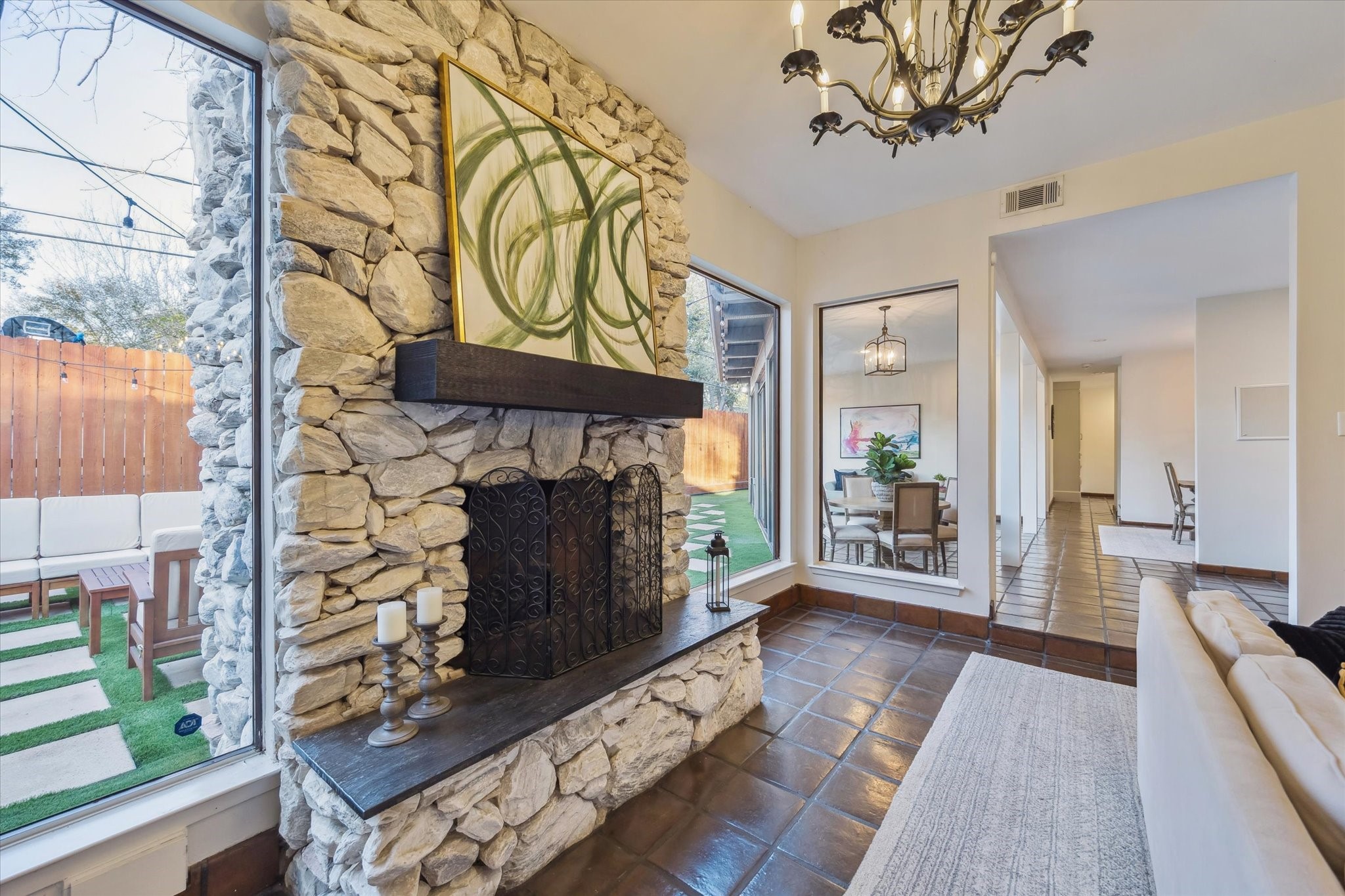 10818 Pepper Lane Houston, TX 77079 - Photo 7 of 34 The living room offers ample natural light through large windows overlooking the backyard