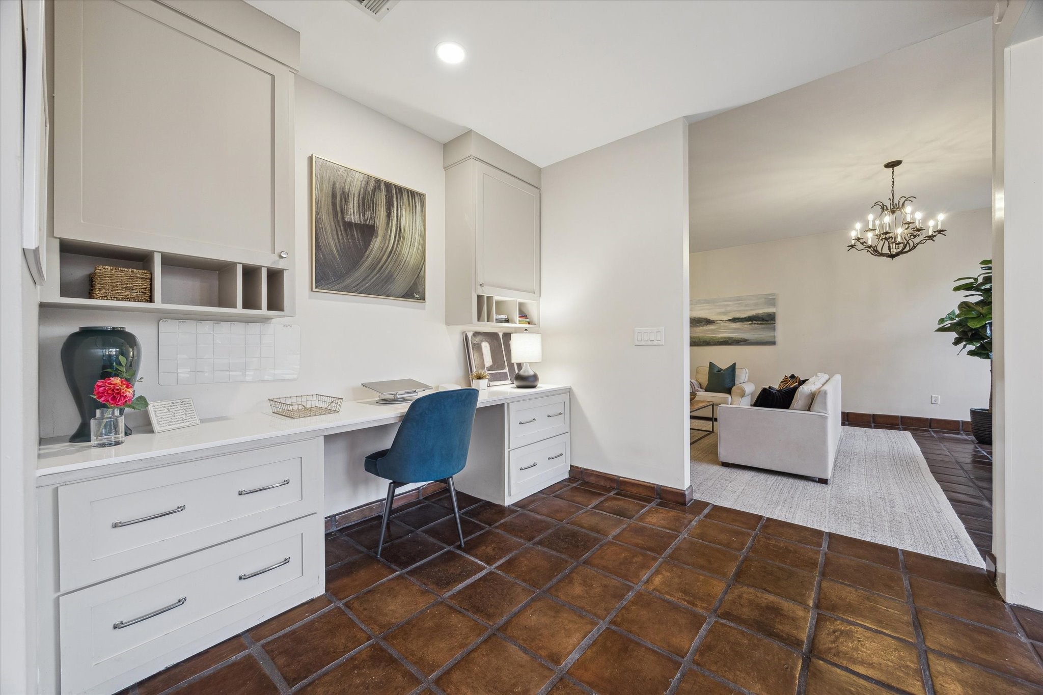 10818 Pepper Lane Houston, TX 77079 - Photo 8 of 34 This office space has built-in cabinetry and a desk, conveniently located off the living room