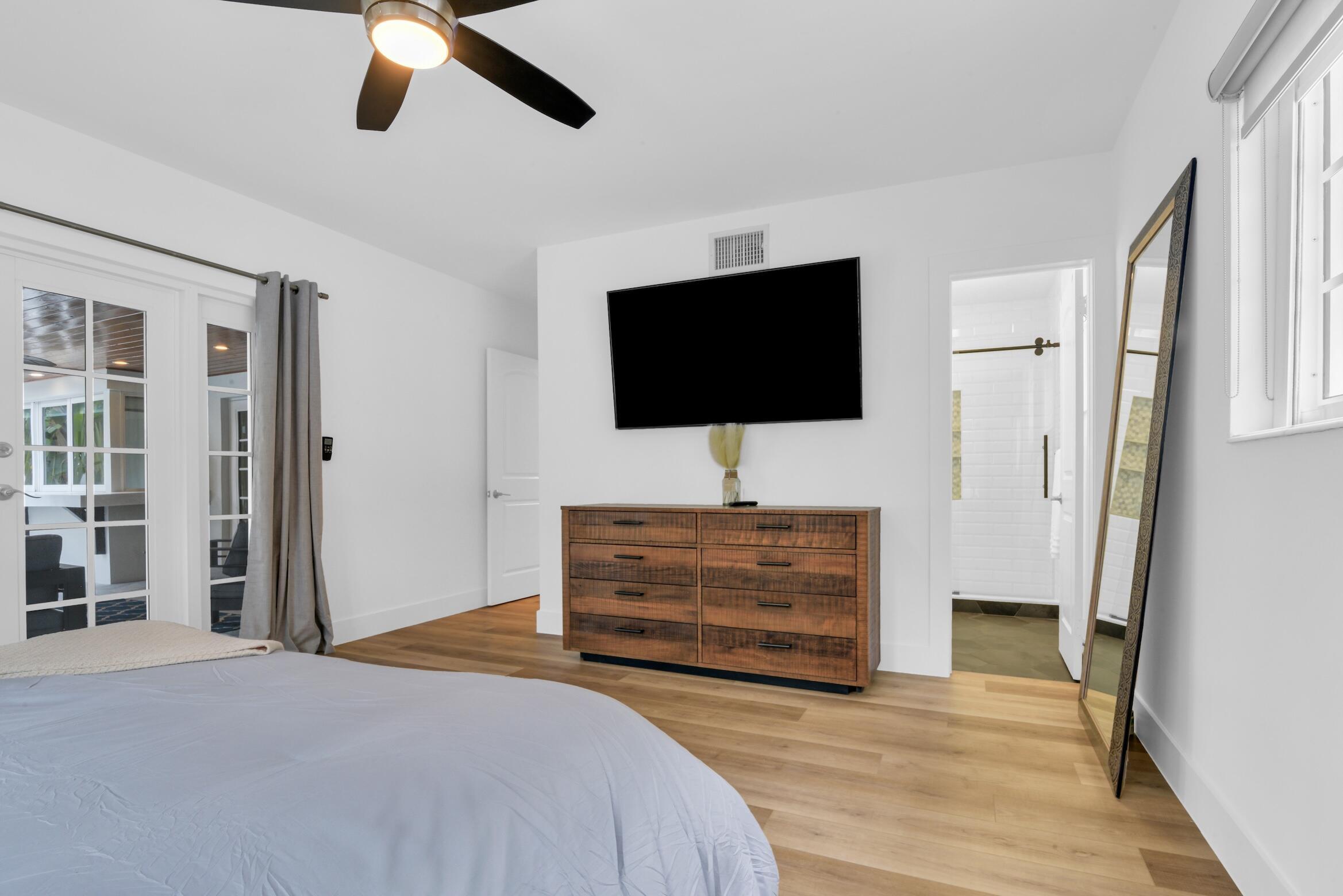 701 Appleby Street Boca Raton, FL 33487 - Photo 30 of 47 a bedroom with furniture and a flat screen tv