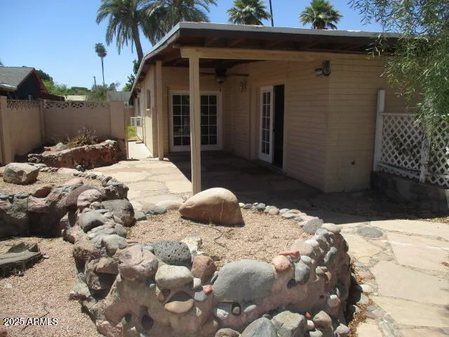 a bedroom with a bed and a potted plant