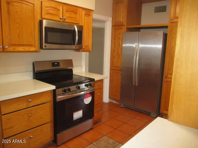 a kitchen with a stove microwave and refrigerator