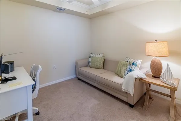 a living room with furniture and a chair