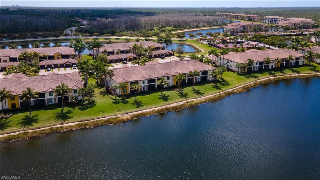 9517 Avellino Way, Unit 2214 Naples, FL 34113 - Photo 29 of 44 an aerial view of residential houses with outdoor space and river