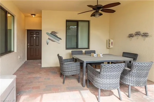 a dining room with furniture and window